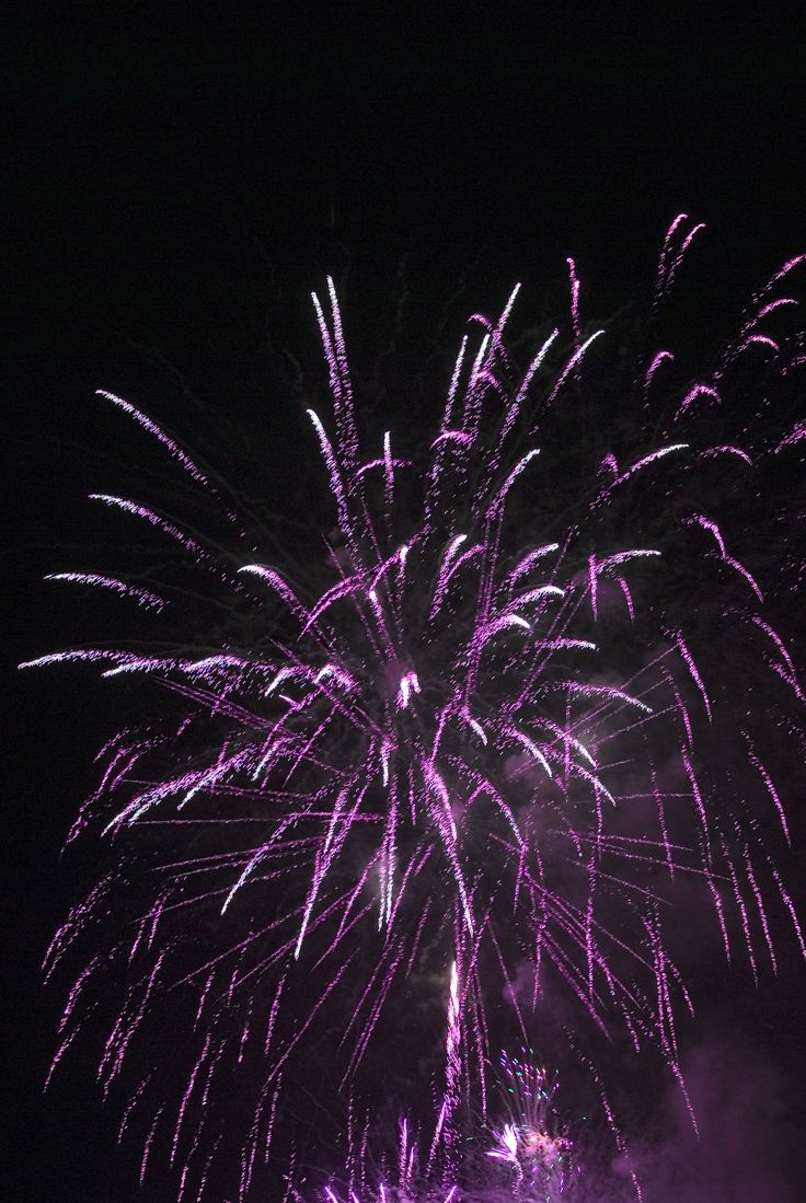 fireworks are lit up in the night sky