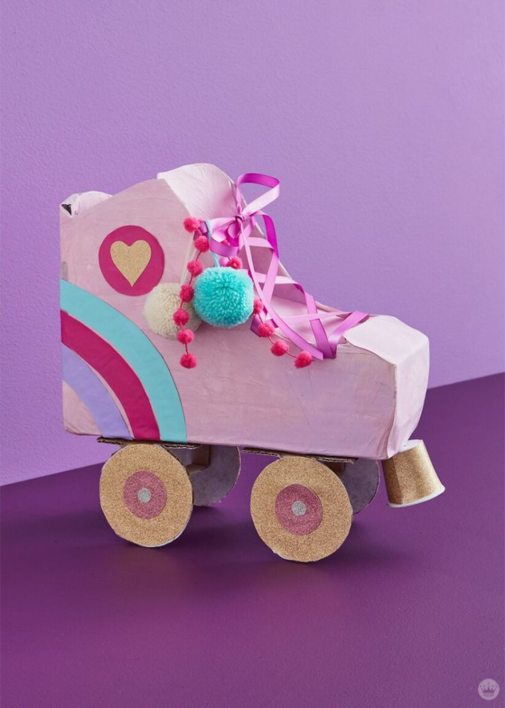 a cardboard roller skate with a heart on it