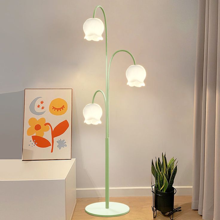 a lamp that is next to a potted plant