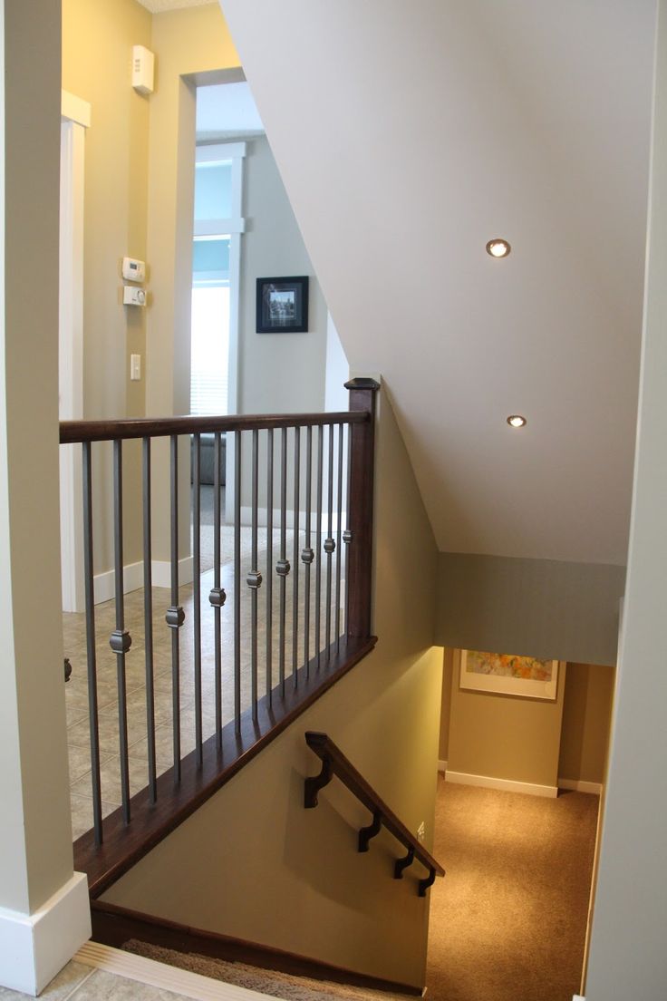 an empty room with stairs leading up to the second floor