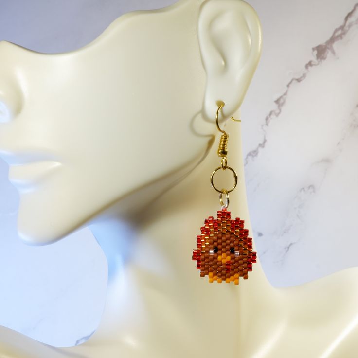 Celebrate Thanksgiving with these *Adorable* Turkey beaded earrings! Cute and festive, these super lightweight earrings are the perfect addition to your dinner wardrobe! Please note that colors may differ slightly depending on your screen. This pair of earrings is made-to-order. Please allow 3-5 business days for processing. *** Design Copyright to BeadCrumbs https://www.beadcrumbshawaii.com/ *** Orange Beaded Earrings As A Gift, Round Beaded Earrings For Gifts, Round Beaded Earrings As Gift, Beaded Dangle Earrings For Gift, Beaded Drop Earrings For Gift, Dangle Beaded Earrings For Pierced Ears, Dangle Beaded Earrings For Pierced Ears Gift, Drop Earrings With Dangling Beads As Gift, Colorful Beaded Dangle Earrings For Gift