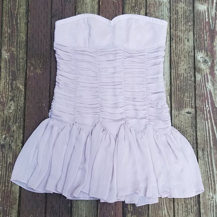 Charlotte Russe - Strapless Party Dress - Size 14. New With Tags, Never Worn. Mauve Color (Pale Lavender/Tan). Zipper On Left Side. Chest Is Slightly Padded. Has Has Anti Slip Rubber Inside Of Dress Along Most Of The Top Part. Same Color And Material Feel But Material Is Laid Out In 3 Different Ways. (1) Chest - Smooth (2) Midsection- Rows And Columns-Puffy (3) Very Bottom Part- Puckered And Flowy. Lining Underneath. 100% Polyester. Please See All Pictures. -Measurements Laying Flat- [Armpit To Spring Strapless Mini Dress With Ruched Bodice, Strapless Mini Dress With Pleated Bodice For Party, Strapless Party Mini Dress With Pleated Bodice, Strapless Mini Dress With Ruched Bodice For Spring, Strapless Spring Mini Dress With Ruched Bodice, Summer Date Night Strapless Dress With Ruched Bodice, Strapless Mini Dress With Lined Bodice For Summer, Summer Bridesmaid Mini Dress With Ruched Bodice, Summer Strapless Mini Dress With Lined Bodice