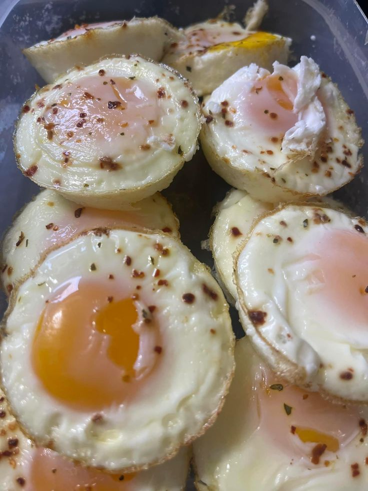 some eggs are sitting in a plastic container