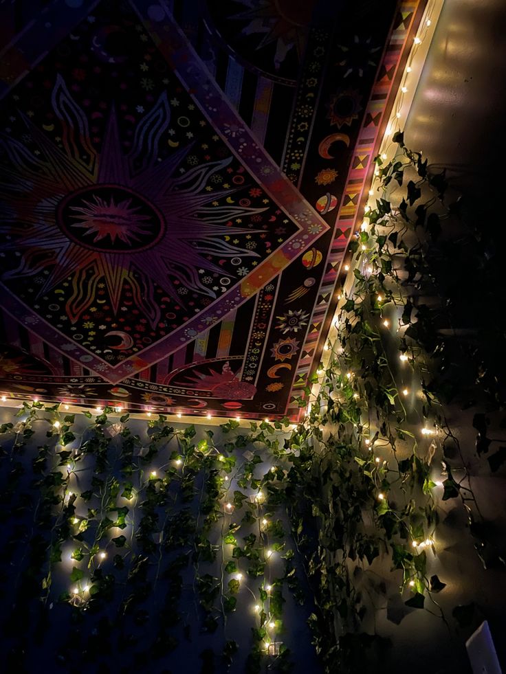 the ceiling is decorated with plants and lights