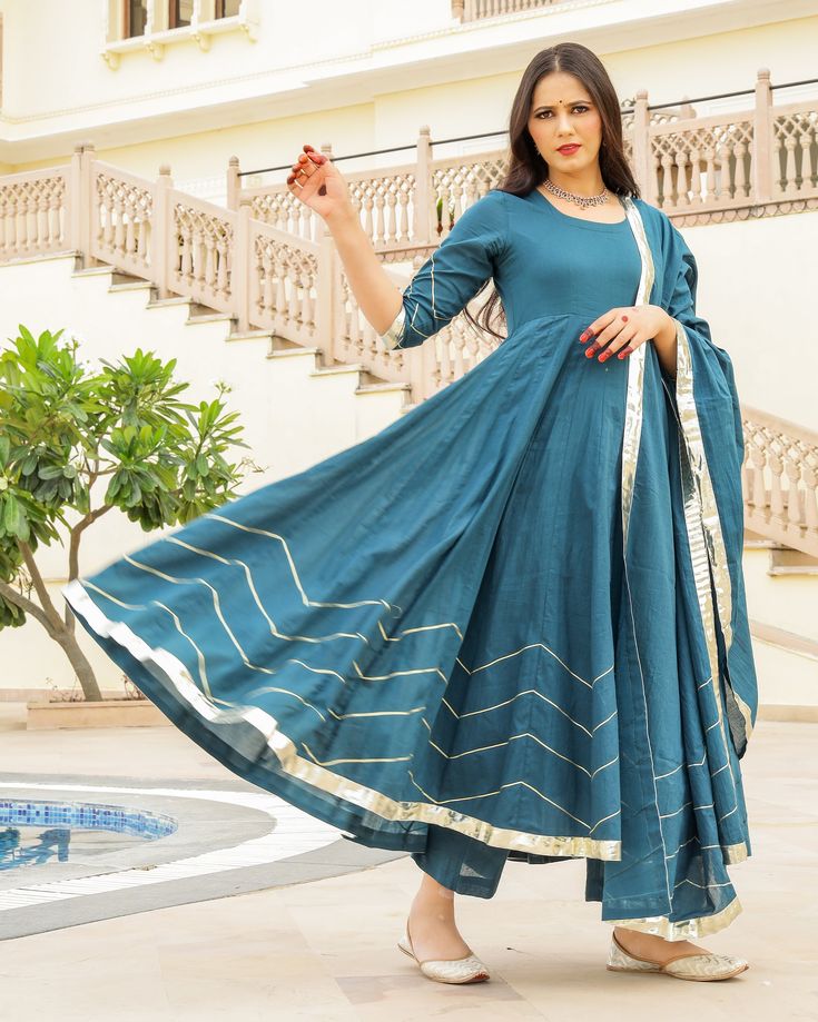 This 3 Pc anarkali Suit set is designed in mul-mul cotton fabric with Gota work mul-mul Dupatta. Kurta Length - 50, Mul-mul Cotton, Gota work With on hem & sleeves. Pant length - 38, Mul-mul cotton. Dupatta - Mul-mul cotton, gota work on edges. Fabric - mul-mul cotton. Color - Bottle Green CARE: dry clean only. Shipping - 10-12 working days. DISCLAIMER - The color of the product may be differ from the image 10-12% due to camera and lights and screen settings of device. Anarkali Set With Cutdana In Mulmul, Mulmul Anarkali Set With Gota Work, Designer Anarkali Kurta In Mulmul, Diwali Anarkali Set With Cutdana In Mulmul, Navratri Anarkali Set With Cutdana In Mulmul, Cotton Silk Anarkali Kurta For Diwali, Unstitched Cotton Silk Anarkali Set For Navratri, Designer Wear Anarkali Set In Mulmul, Anarkali Mulmul Palazzo Set For Eid