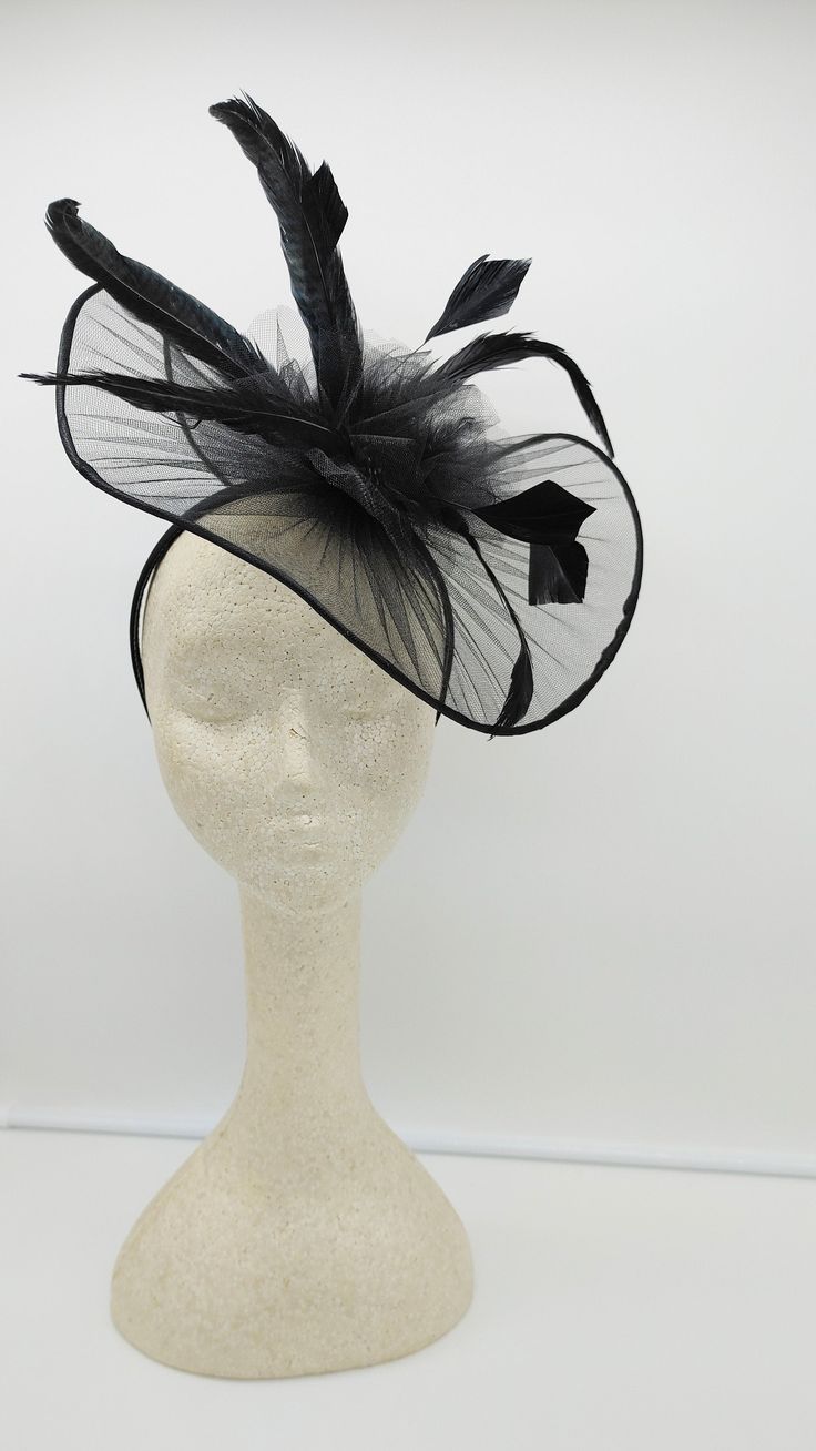 Classic large black Fascinator for every occasion. Light weight and classic addition to your outfits. It can customized with different colors of feathers and or flowers. Do you want it in a different color? Send me a message. - 40 inches contour brim - Rare find - Ready to ship - Fast Shipping - Free Shipping - Group discount available - Customize by adding different color flowers and or feathers Check my store for for styles and colors. Hatsandpearls.etsy.com Find more at my website for more st Elegant Feathered Fascinator For Party, Elegant Feather Fascinator For Party, Black Short Brim Party Headpiece, Elegant Black Feather Trim Costume Hat, Black Costume Hats For Royal Ascot Party, Elegant Black Costume Hat With Feather Trim, Black Short Brim Headpiece For Party, Black Summer Hat With Feather Trim, Black Summer Hats With Feather Trim