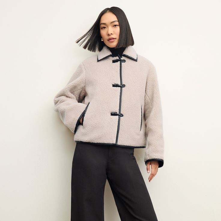 The Eli jacket is our version of that on-trend coat you��’ve been debating. Featuring a slightly tented silhouette and a length that hits around the hip, it fits over your chunkiest sweaters while forming an elongating shape. Special touches like faux leather trimming and toggle closures create an extra-luxurious look. ﻿ Made in China with fabric from China. Coat Trends, Shearling Coat, Sherpa Jacket, Chunky Sweater, Sherpa Lined, Women Supporting Women, Work Fashion, Wool Jacket, Her Style