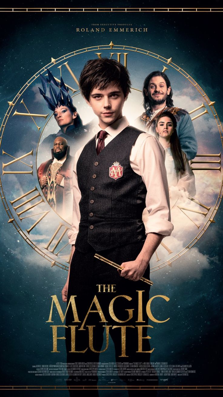 the magic flute movie poster with an image of a man in vest and tie holding a wand