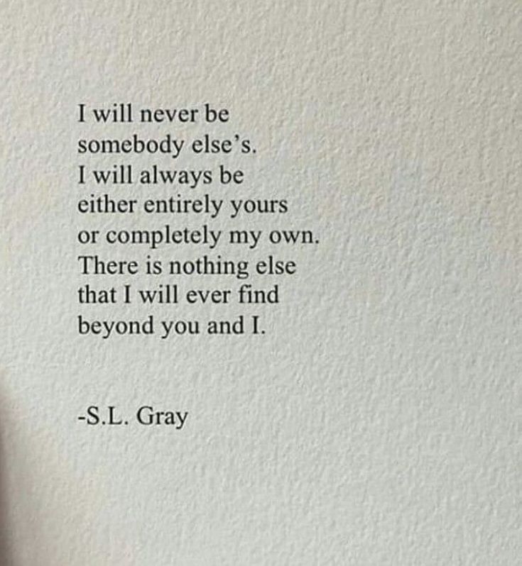 a hand holding a pen and writing on a paper with the words i will never be somebody else's i will always be either yours