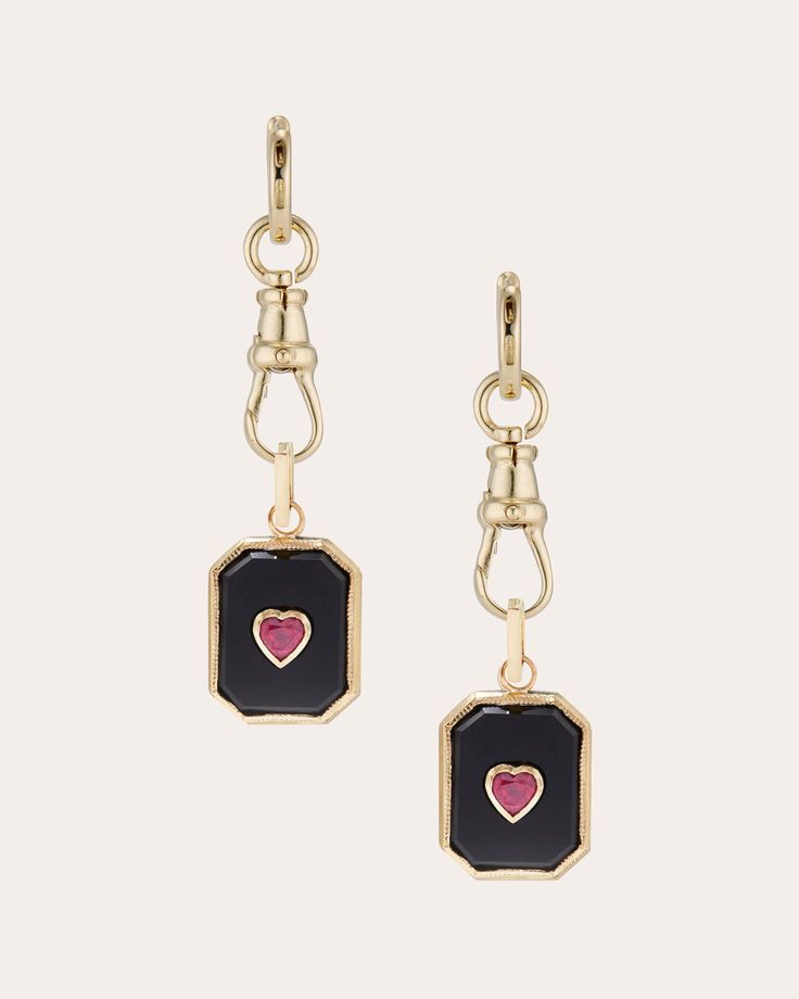 Attached to the hoops with Ashley Zhang's signature dog clip clasp, these 14-karat gold earrings detail their octagonal drops with inlaid black onyx and beaded milgrain trim. The heart-cut ruby centers are placed in classic bezel settings for a vintage look. Hinge closure Detachable charm drops 14k yellow gold, black onyx and ruby Carat: 0.4 ctw ruby Polish with soft cloth Handmade in the USA Measurements Width: 0.47in Length: 1.06in Convertible Earrings, Quilted Boots, Ruby Heart, Dog Clip, Large Jewelry, Engraved Jewelry, Clothes Gift, Black Onyx, Gold Black