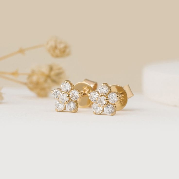 Alondra These dazzling floral stud earrings feature a cluster of natural diamonds, arranged in a delicate flower shape. Crafted from luxurious 14K yellow gold, they add a touch of feminine elegance to any outfit. Perfect for special occasions or elevating your everyday style. - Handmade- Solid Gold- Natural Diamonds - G Color, SI Quality Diamonds- Dimension of Flower: 6 mm- Total Diamond Carat Weight: 0.36 ctw All pieces come beautifully boxed in suede pouches you can always use when traveling! Classic Yellow Gold Flower-shaped Cluster Earrings, Flower Diamond Earrings, Gift Cluster Earrings With Rose Cut Diamonds, Gift Rose Cut Diamond Cluster Earrings, Gold Diamond Flower Cluster Earrings, Yellow Gold Diamond Cluster Earrings In Flower Shape, Yellow Gold Diamond Flower Cluster Earrings, Yellow Gold Flower Cluster Earrings For Anniversary, Yellow Gold Flower-shaped Cluster Earrings For Wedding