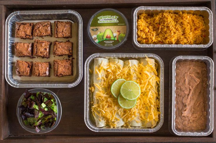 the meal is prepared and ready to be eaten on the table with other foods in trays