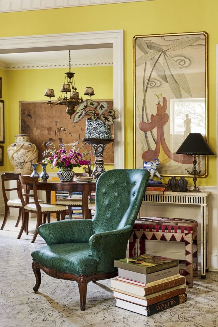 a living room with yellow walls and furniture