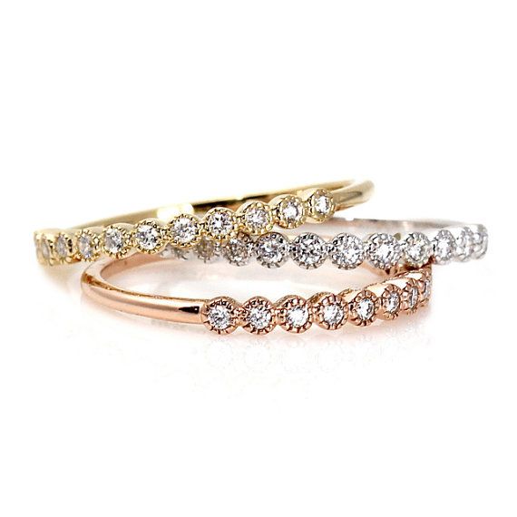 three different types of rings with diamonds on each one and the other in yellow gold, white