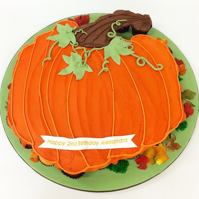 there is a birthday cake that looks like a pumpkin