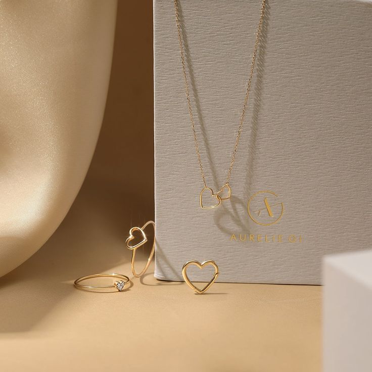 This design is inspired by the everlasting bond of love and friendship and makes for the sweetest gift. Crafted in polished 14kt gold, this updated classic symbolizes that special, eternal connection. Product Details: Material: 14K Solid Gold Chain Type: Cable Chain 0.7mm thickness Chain Length: 16 inches Extension chain: 2 inches Bigger Heart Size: 8*7.5mm Smaller Heart Size: 6*5.7mm Luxury Jewelry Brands, Love And Friendship, Hearts Necklace, Solid Gold Chains, Solid Gold Jewelry, Small Heart, Big Heart, 14kt Gold, Diamond Gemstone