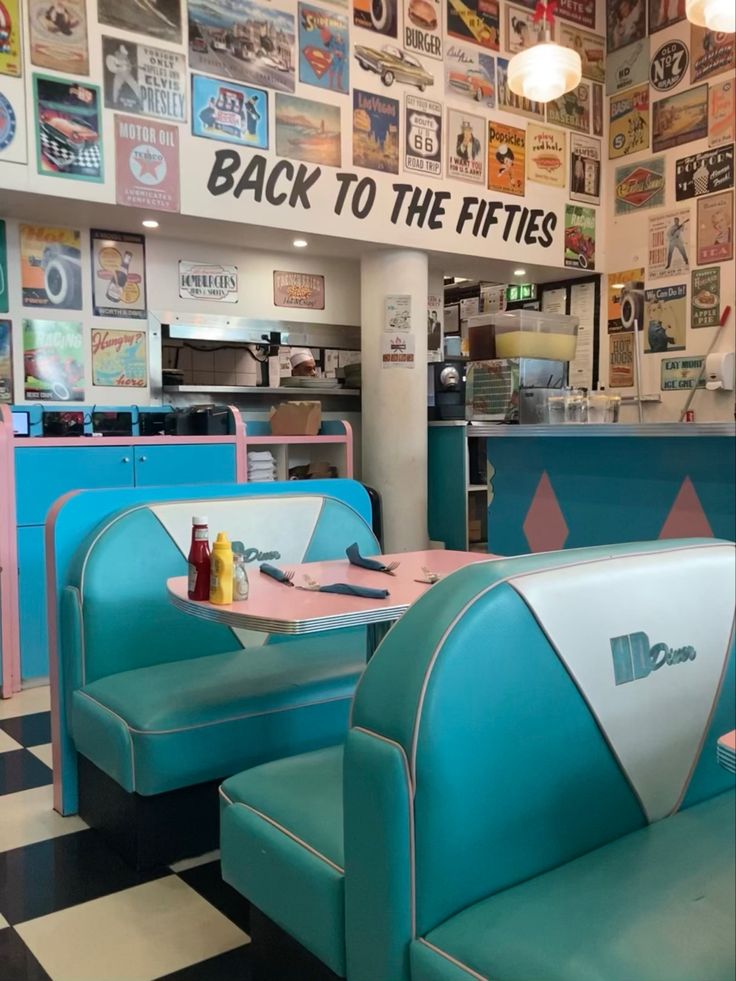 the interior of a fast food restaurant with blue booths