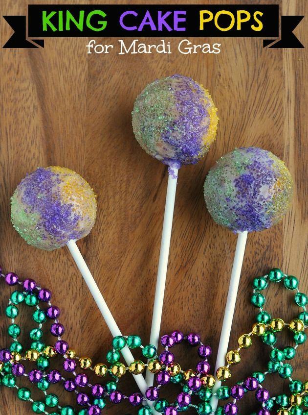 some lollipops are sitting on the table with beaded decorations around them