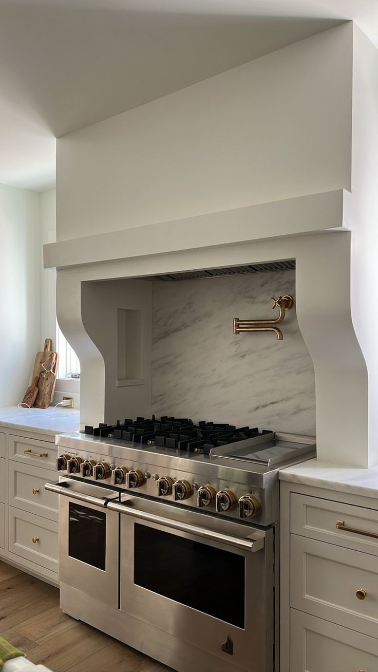 a kitchen with an oven, stove and counter tops in it's center island