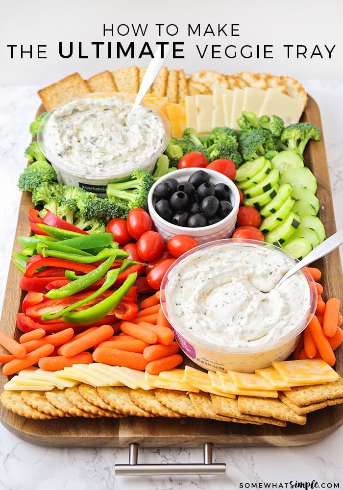 the ultimate veggie tray is loaded with dips, vegetables and crackers