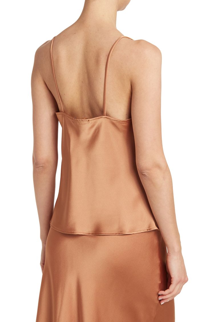 Constructed from smooth satin, a cowl-neck camisole lends elegant versatility to your date-night looks. 26" length (size S) Cowl neck Spaghetti straps Woven 97% polyester, 3% spandex Machine wash cold, line dry Made in the USA of imported materials Model stats: 5'10", 32" bust, 25" waist, 36" hip. Model is wearing size S. Sleeveless Satin Tops With Bias Cut, Satin Camisole For Date Night, Night Out Satin Finish Camisole, Elegant Evening Camisole, Chic Solid Color Silk Camisole, Satin Cami For Night Out, Satin Top With Tank Straps For Evening, Satin Camisole Top For Date Night, Elegant Silk Camisole For Date Night