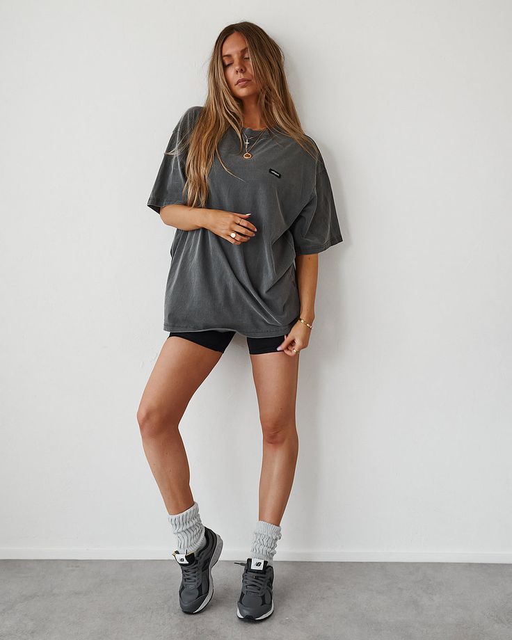 Oversized dropped shoulder Tee with Oldsport logo chest patch. COLOUR: Washed Black FABRIC: 100% mid-weight Cotton SIZING: Model is 5'9 and wearing L/XL Urban Oversized Washed Black Top, Oversized Gray Sportswear Top, Sporty Gray Drop Shoulder Top, Oversized Solid Color Sporty T-shirt, Oversized Solid Sporty T-shirt, Oversized Sporty Top For Streetwear, Gray Urban Tops For Loungewear, Sporty Oversized T-shirt, Sporty Oversized Top For Streetwear