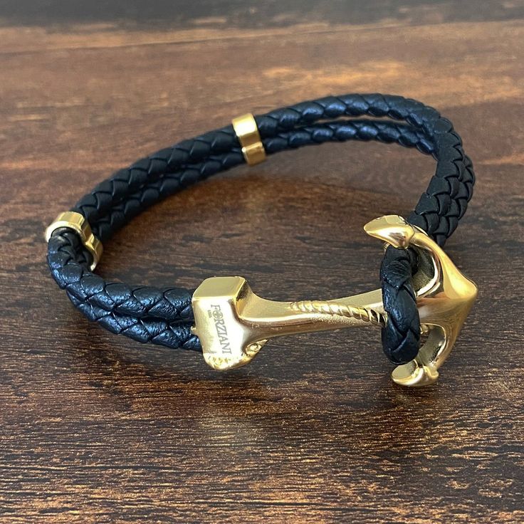 luxurious, hand-braided leather and finished with polished gold Anchor, Maritime bracelet is an instant classic, making it a stylish option for any outfit. Wear it alone or pair it with your watch to finish off a modern tailored look. Premium Woven Black Nappa Leather Stainless Steel with 14K Gold Bonding Bracelet, 10mm Wide Leather Anchor Bracelet, Double Wrap Bracelet, Gold Bond, Gold Bracelet Cuff, Meaningful Jewelry, Silver Chain Necklace, Braided Leather, Chain Link Necklace, Jewelry Pouch