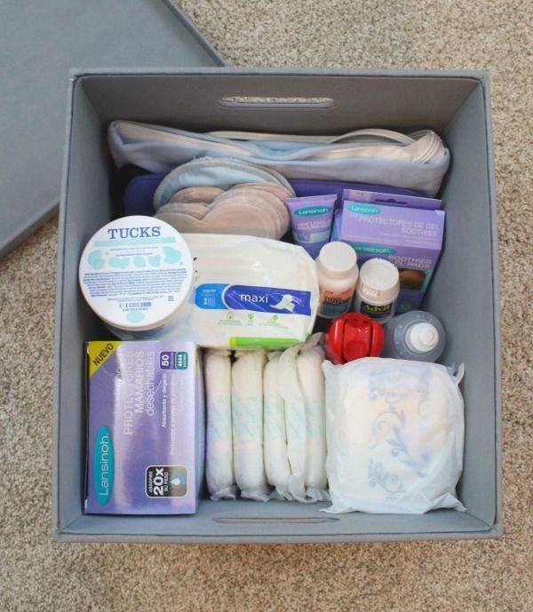 the contents of a diaper are neatly packed in a storage box on the floor