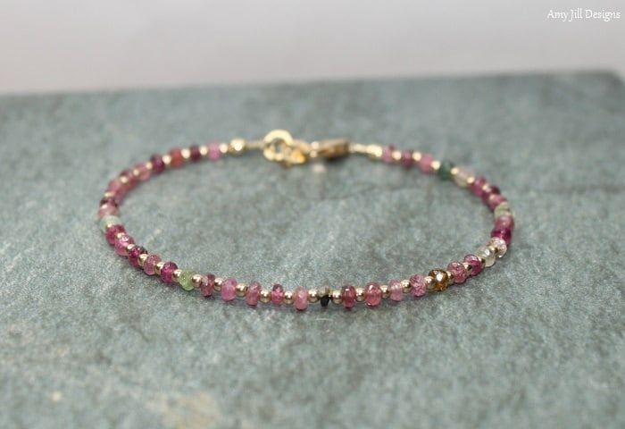 This dainty bracelet has beautiful genuine and natural watermelon tourmaline faceted rondelles. The bracelet mostly features pink tourmaline with some green and golden hues throughout. Gold filled beads surround the tourmaline beads. You can choose from rose gold filled, gold filled or sterling silver beads. The gemstone beads are strung on high quality beading wire and the bracelet closes with a gold filled lobster clasp. The tourmaline shades of colors in this bracelet are gorgeous! All metals Watermelon Tourmaline Jewelry, Beaded Jewelry Earrings, Cat Tat, Beaded Jewelry Bracelets, Beaded Jewlery, Tourmaline Bracelet, Beaded Jewelry Designs, Tourmaline Jewelry, Dainty Bracelet