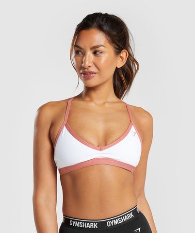 IT’S NOT YOU, IT’S YOUR SPORTS BRA With lightweight, breathable designs, comfortable cups and supportive straps, you can rely on our sports bras to be there for you, and for yours. • Personalise your look by mix and matching the removable bra straps • Lower coverage SIZE & FIT • Low support • Body fit • Model is 5'8" and wears a size XS MATERIALS & CARE • 78% Polyester, 22% Elastane SKU: B3A2J-WCJ8 Cute Gym Outfits Shorts, Gym Outfits Shorts, Gym Outfit Shorts, Gymshark Minimal, Women Gym Outfits, Cute Sports Bra, Gym Bra, Gym Jacket, Cute Gym Outfits