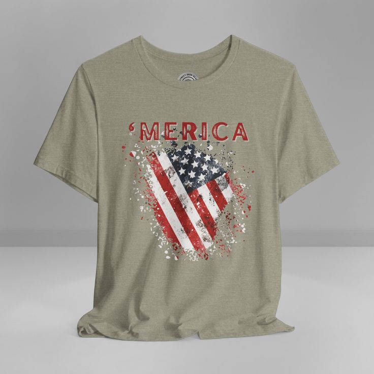 Show your unwavering support with our American Patriot T-shirt! This tee proudly features a grunge style American Flag with the bold statement ''Merica' making this T-shirt a stylish choice for a true American patriot. Product details This classic unisex jersey short sleeve tee fits like a well-loved favorite. Soft cotton and quality print make users fall in love with it over and over again. These t-shirts have-ribbed knit collars to bolster shaping. The shoulders are tapered for a better fit over time. Dual side seams hold the garment's shape for longer. >Bella Canvas 3001 TShirt >This t-shirt comes with a lightweight fabric (4.2 oz/yd² (142 g/m²)) >The tear-away label minimizes skin irritations and provides a scratch-free wearing experience. >Fabric blends: Ash - 99% Airlume combed and r American Flag Print Tops For Memorial Day Streetwear, Memorial Day American Style Graphic Print Top, American Flag Print Top For Independence Day, American Style Graphic Print Tops For Memorial Day, Graphic Print Tops For Independence Day Streetwear, Memorial Day American Flag Print Tops For Streetwear, Memorial Day Graphic Tee Made In Usa, Independence Day Graphic Print Tops For Streetwear, Memorial Day American Flag Print Top For Streetwear