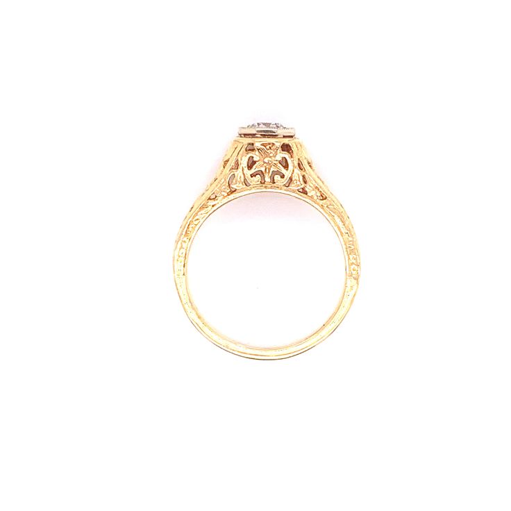 Vintage 1990's 14k yellow gold vintage reproduction filigree engagement ring. The diamond weighs approximately .23ct and is a G color and I1 clarity. The size of the ring is a 6.25, and has the ability to be resized. Formal Gold Filigree Ring With Center Stone, Gold Filigree Ring With Center Stone For Formal Occasions, Classic Gold Filigree Ring With Center Stone, Gold Filigree Promise Ring With Center Stone, Vintage Gold Filigree Ring With Intricate Design, Classic Gold Rose Cut Diamonds Wedding Ring, Gold Filigree Wedding Ring With Center Stone, Ornate Gold Diamond Ring For Formal Occasions, Gold Filigree Ring With Center Stone For Wedding