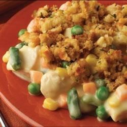 a red plate topped with vegetables and stuffing