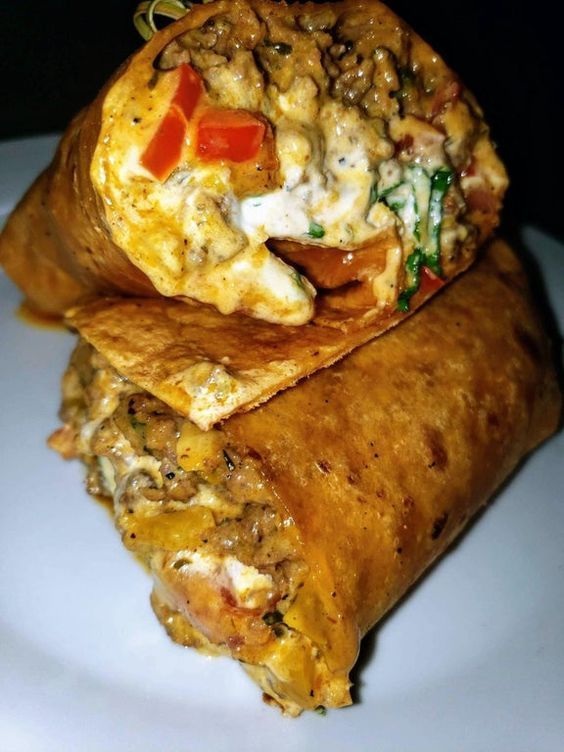 two burritos are stacked on top of each other