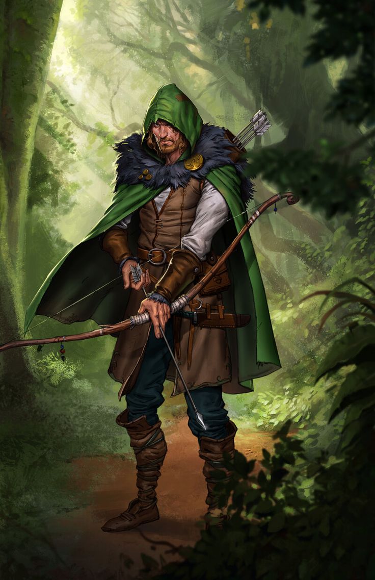 a man dressed in medieval clothing holding a bow and arrow while standing in the woods