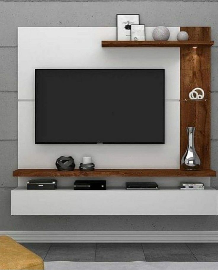 a modern living room with a flat screen tv mounted on the wall and wooden shelves