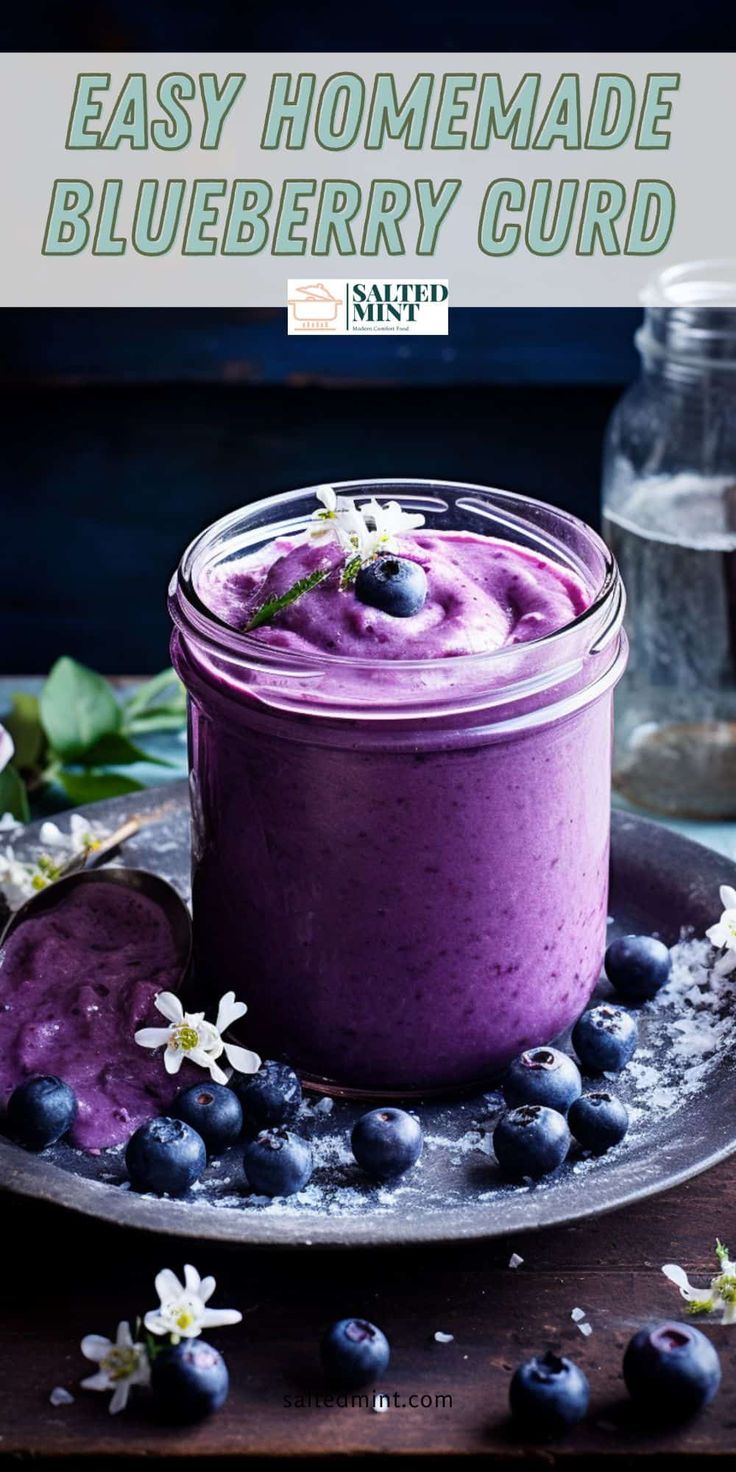 blueberry curd in a glass jar on a plate