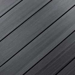 a close up view of a wooden floor with black woodgrain and white trim