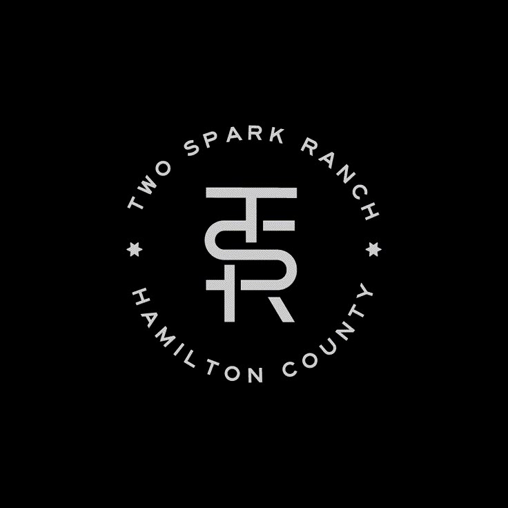 the two spark ranch logo is shown on a black background with white letters and stars