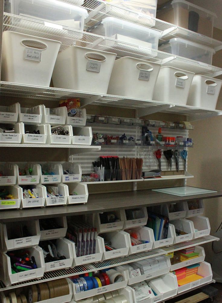 the shelves are filled with plastic containers and supplies