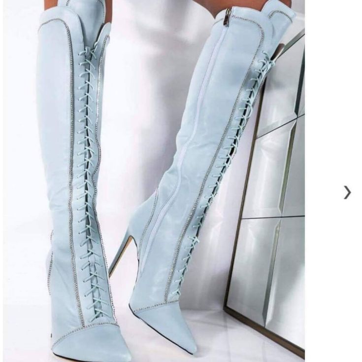 Stylishly Fierce Boots. Available In A Size Standard 8 Boots. These Boot Are Sure To Turn Many Heads. These Stylish Flux Leather Boots Lace Up In The Front,Have A Inner Zipper On The Seem Of The Boots To Get Into The Boots More Easily Without Having To Adjustthe Laces. They Are A Soft Baby Blue Color With Placements Of Diamonds That Go Around The Boots. It's A Must Have Boot To Add To Your Stylish Collection Of Boots. Firm Pricing And No Negotiation! Thank Me Later When You Receive All The Complements.... Diamond Boots, Trendy Fitted Blue Knee-high Boots, Chic Blue Knee-high Heeled Boots, Elegant Blue Ankle-high Boots, Blue Leather Ankle-high Boots, Chic Blue Ankle-high Heeled Boots, Baby Blue Color, Baby Blue Colour, Thank Me Later