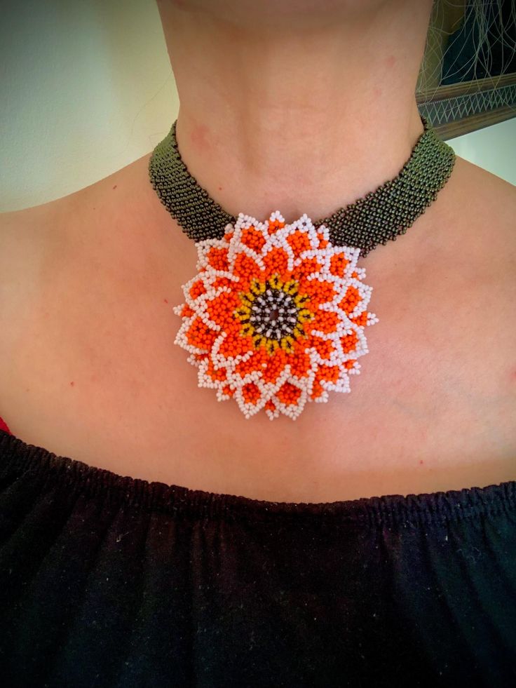 Unique handmade necklace with flower gerbera, flower - Huichol weaving, braid - square. Woven on thread "Titan", fittings surgical steel. Flower size 8 cm. Made of Czech beads 10/0 Handmade Orange Necklace With Flower Pendant, Handmade Orange Flower Pendant Necklace, Handmade Orange Flower-shaped Jewelry, Orange Flower Beaded Necklace, Unique Adjustable Flower Necklace, Orange Flower Shaped Beaded Necklace For Gift, Handmade Orange Rectangular Jewelry, Handmade Rectangular Orange Jewelry, Handmade Adjustable Rectangular Necklace