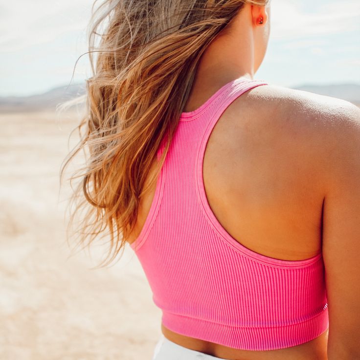 Are you looking for the perfect tank top that pairs effortlessly with all your summer favorites? Look no further than the Washed Hot Pink Ribbed Racerback Tank Top! Made with a premium lightweight and airy fabric, this tank features a classic ribbed design, v-neckline, and racerback style that create a timeless look.The Washed Hot Pink Ribbed Racerback Tank Top is the ultimate must-have for those hot summer days. Not only is the ribbed design incredibly flattering, but it’s also incredibly breat Seamless Stretch Summer Tank Top, Seamless Summer Tank Top For The Beach, Seamless Summer Sports Bra For Everyday, Spring Ribbed Sports Bra For Workout, Casual Ribbed Sports Bra For Spring, Summer Seamless Athleisure Tank Top, Summer Yoga Activewear With Ribbed Detail, Summer Athleisure Seamless Tank Top, Seamless Sports Bra For Everyday Summer Wear