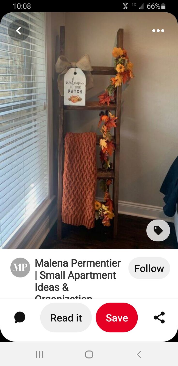 a ladder that has flowers on it in front of a window with the words fall blanket ladder