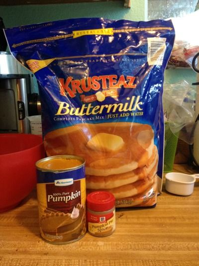 some kind of food that is sitting on a wooden table next to a bag of buttermilk