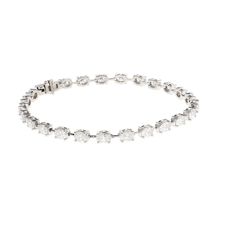 This Estate Platinum 6.00CTW Oval Diamond & Bar 7'' Tennis Bracelet is the epitome of luxury and elegance. With 25 masterfully cut oval shape diamonds, each has a Color Grade of GH and a Clarity Grade of VS set in 9.3 DWTS of Platinum. This extraordinary estate design is the utmost quality and is a timeless addition to any jewelry collection. Luxury Oval Diamond Bracelet With Single Cut Diamonds, Luxury Oval Diamond Bracelet, Luxury Tennis Bracelet With Oval Links, Luxury Vintage Platinum Tennis Bracelet, Luxury Oval Diamond Bangle, Fine Jewelry Oval Diamond Bracelet With Accents, Oval Diamond Bracelet With Diamond Accents, Oval Diamond Bracelet With Accents, Oval Diamond Bracelets With Diamond Accents