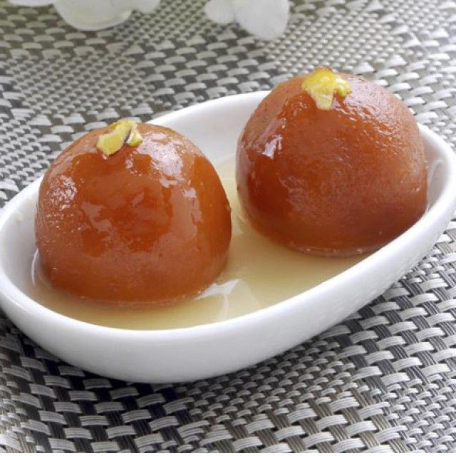 two pieces of food sitting in a white bowl