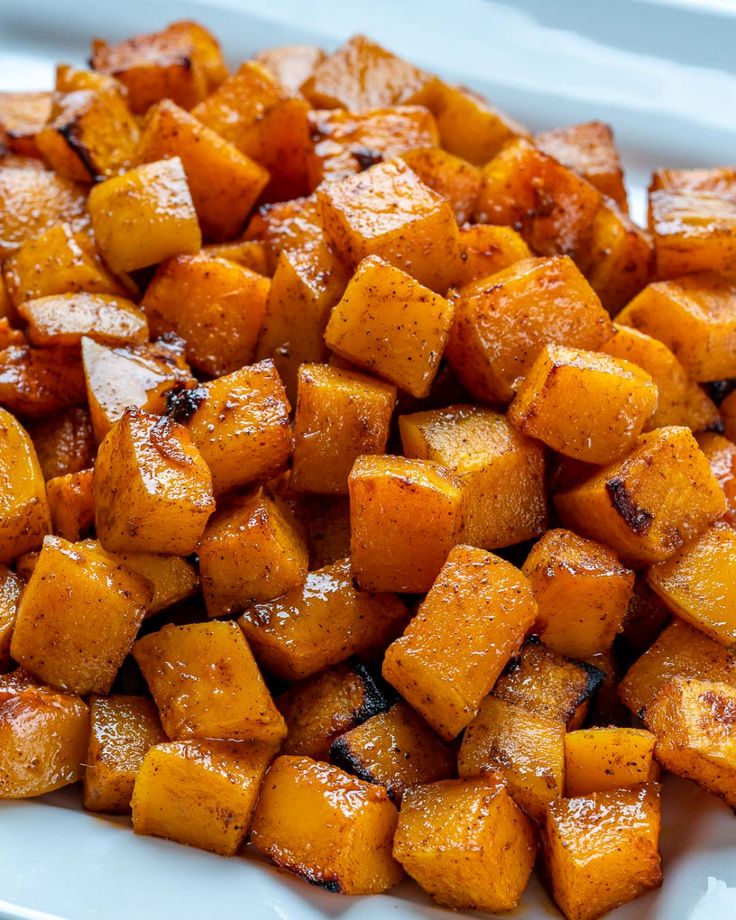 a white plate topped with cooked sweet potatoes