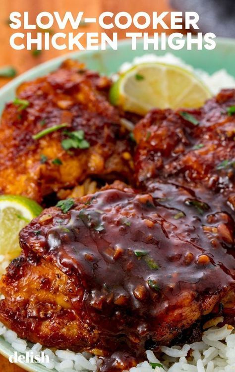 slow - cooker chicken thighs are served with rice and garnished with cilantro