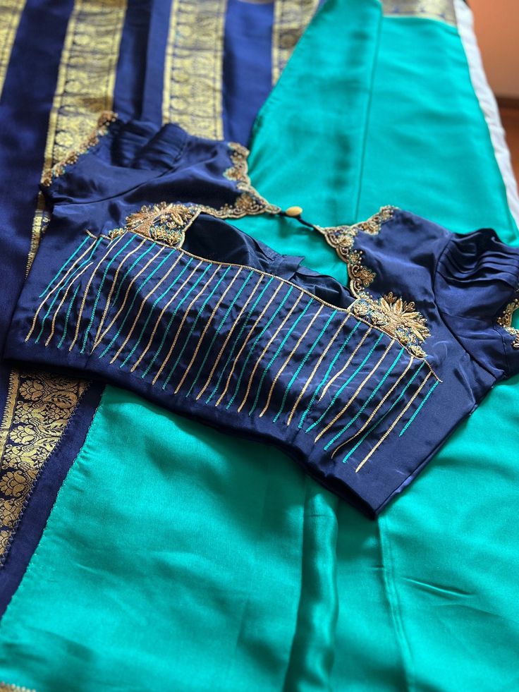 Mysore silk saree pure zari saree with stitched blouse standard size 42. Beautiful Hand embroidery done on the blouse. Anarkali Style Pre-draped Saree With Unstitched Blouse, Green Saree Blouse With Zari Weaving, Blue Pre-draped Saree With Unstitched Blouse For Puja, Semi-stitched Silk Saree With Dori Work, Green Anarkali Blouse In Dola Silk, Green Anarkali Dola Silk Blouse, Bollywood Green Blouse With Zari Weaving, Silk Blouse Piece For Designer Wear During Navratri, Resham Embroidered Blouse Piece For Diwali